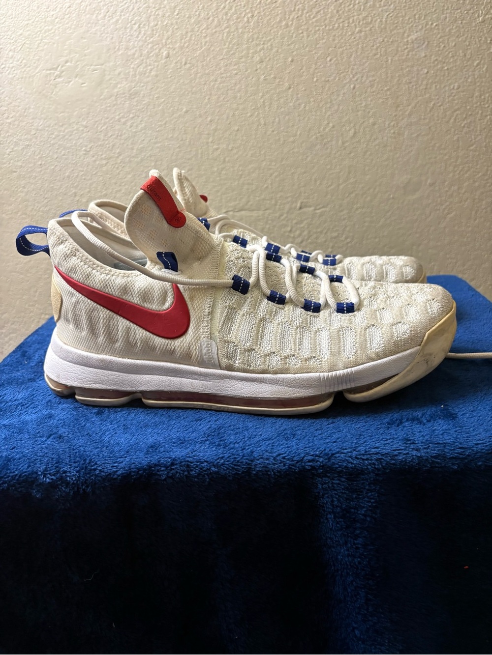 Nike Cream Athletic Shoes with Red Swoosh and Blue Accents